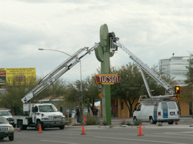 Bucket crane trucks installing the Gateway Saguaro